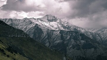 scenic view of snow covered mountain in chamoli