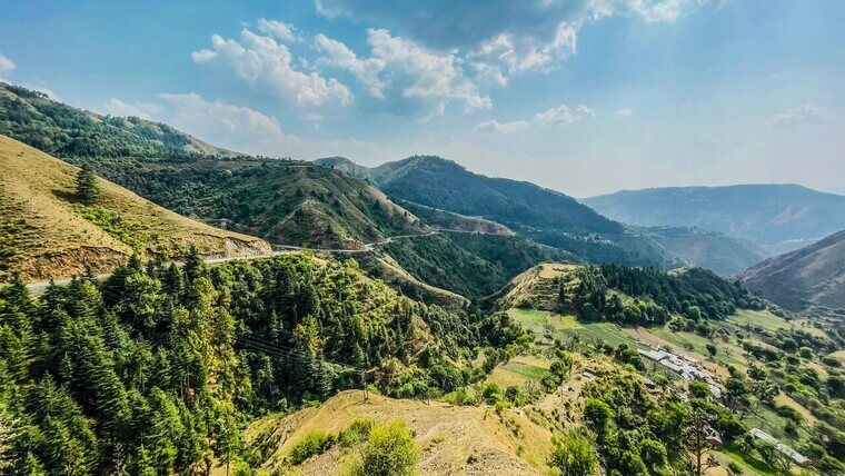 scenic landscape filled with green mountains in chakrata