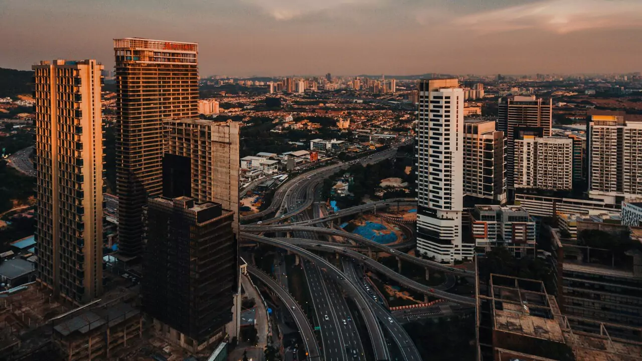 High-rise buildings dominate the skyline in this aerial view of a bustling city.