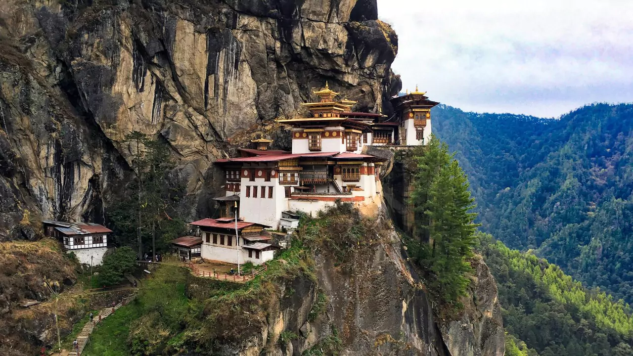 Tiger's Nest Monastery, located on a cliff, offers breathtaking views of the surrounding mountainous landscape.