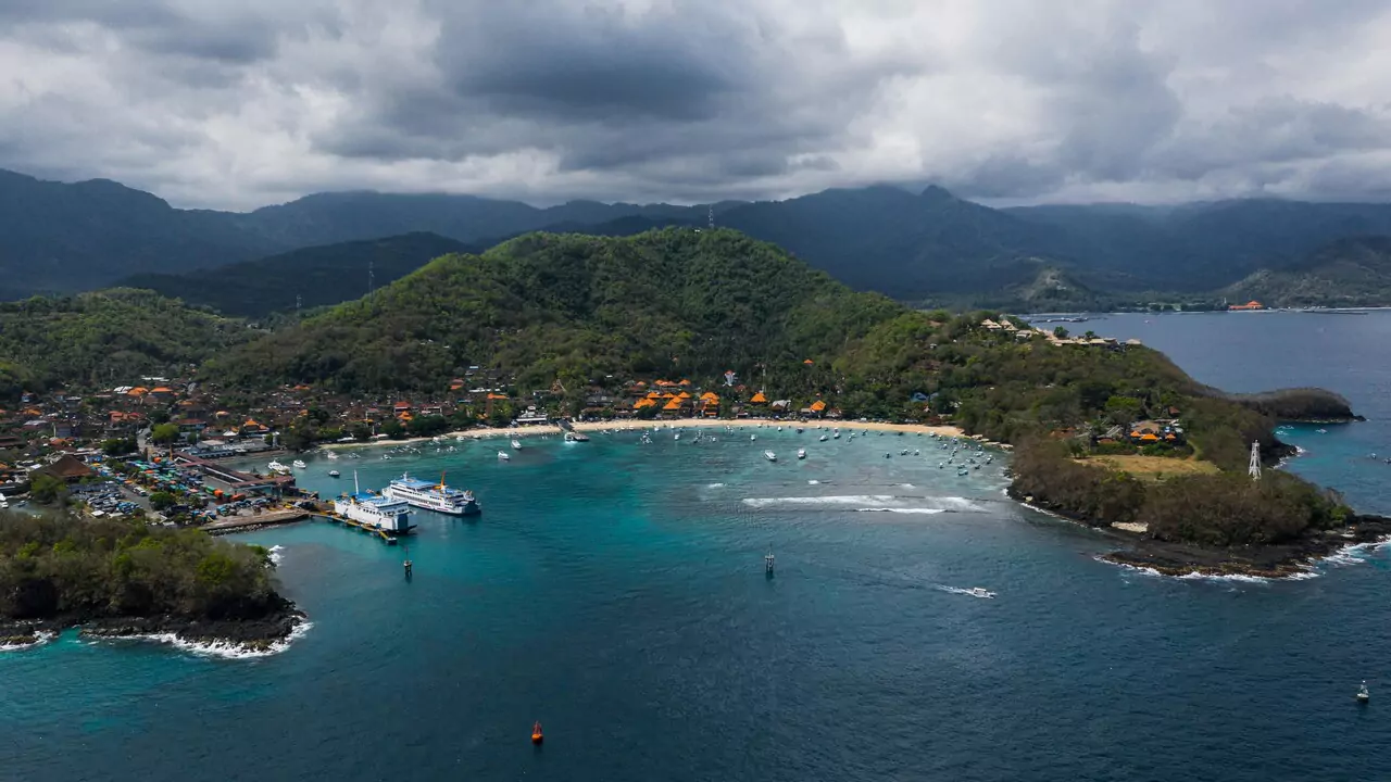 Aerial perspective of Bali island with its stunning beaches, tropical vegetation, and mountainous terrain.