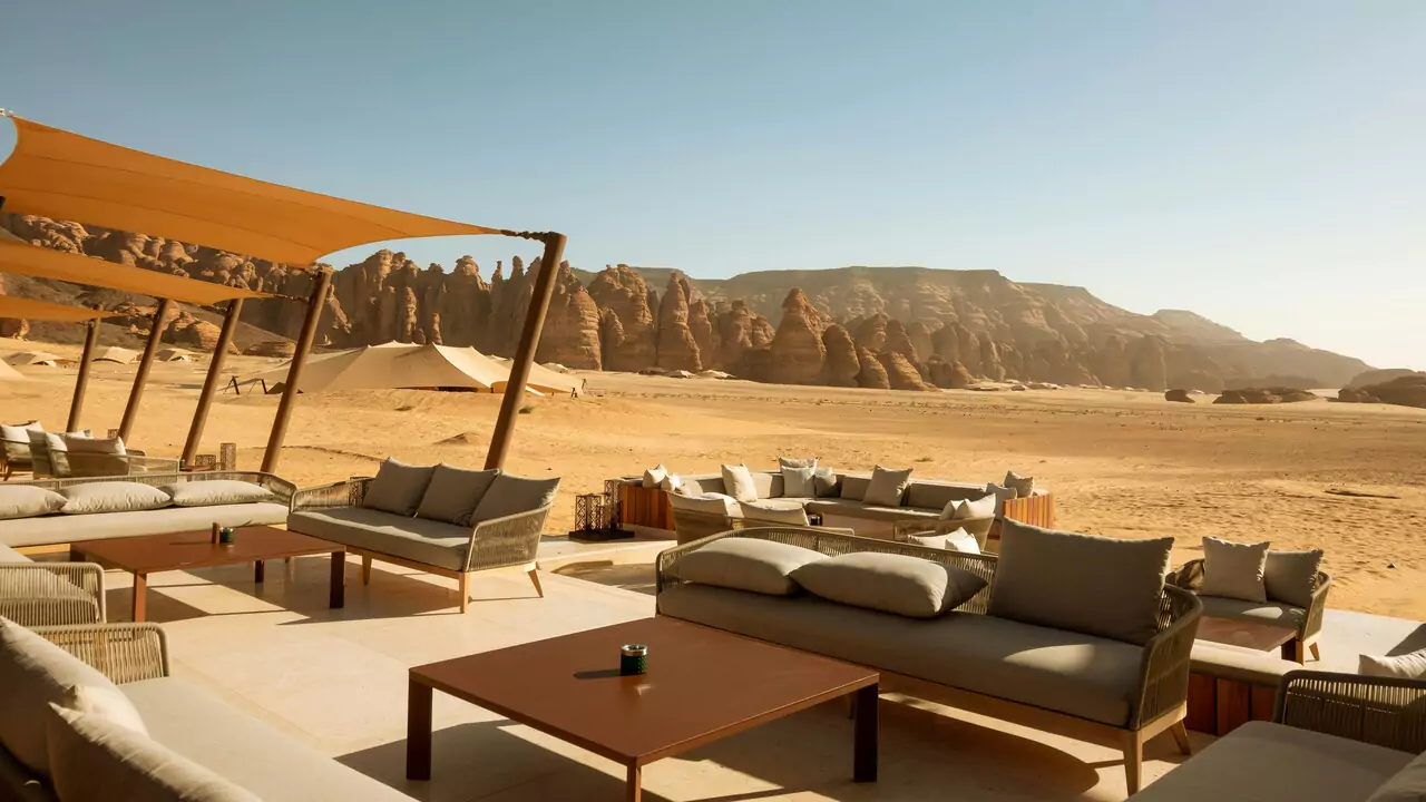 Cozy lounge area at a desert resort, featuring comfortable seating and stunning views of the desert.