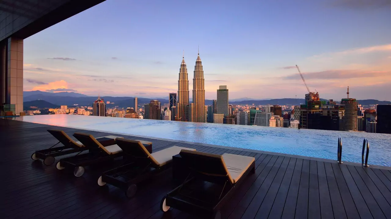 Infinity pool at a hotel in Kuala Lumpur, featuring stunning city views and a sleek modern design.
