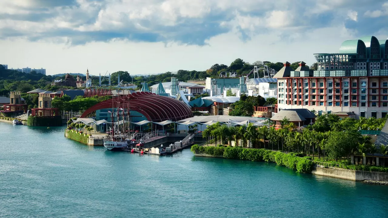 Aerial view of Singapore's Sentosa island showcasing its skyline, modern buildings.