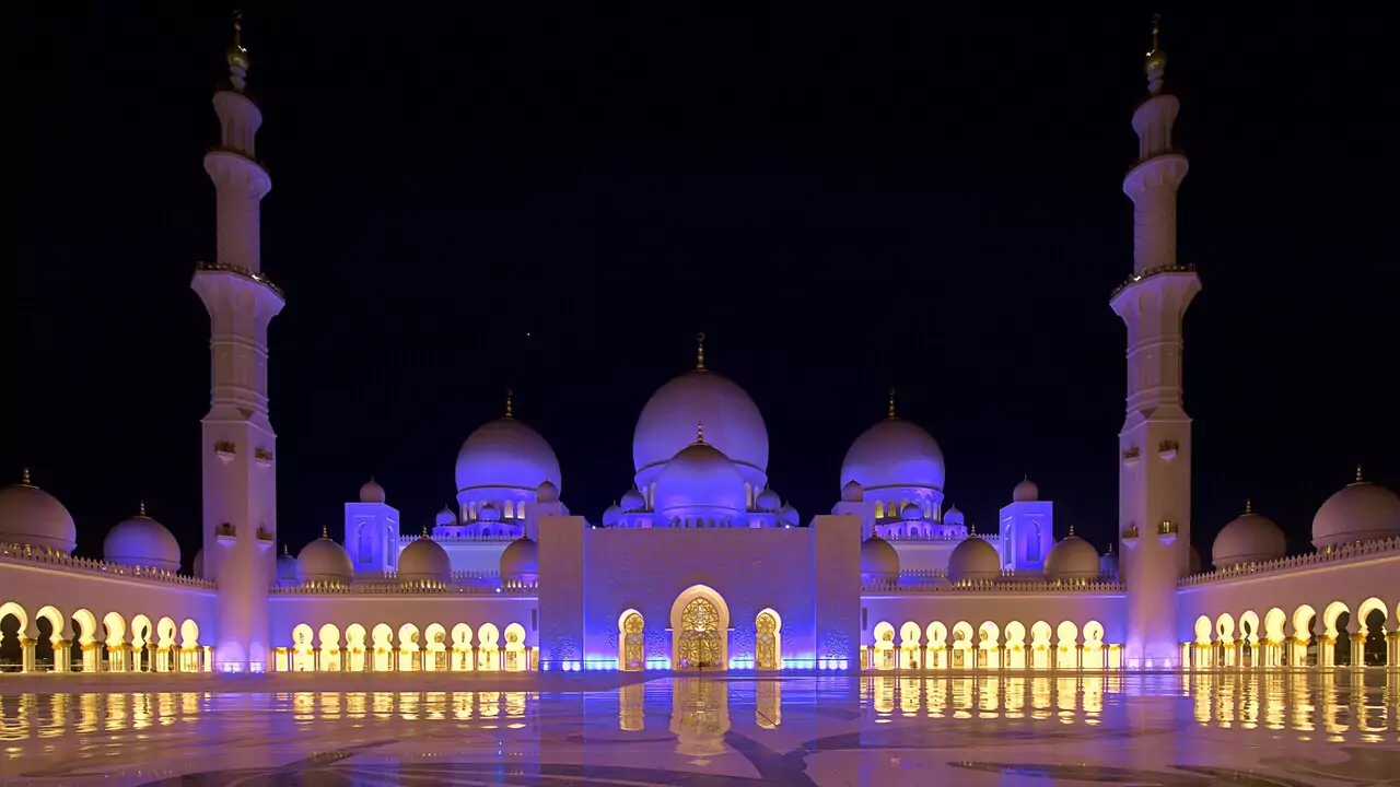 Sheikh Zayed Grand Mosque featuring intricate designs and beautiful white marble.