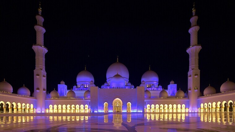 Sheikh Zayed Grand Mosque featuring intricate designs and beautiful white marble.